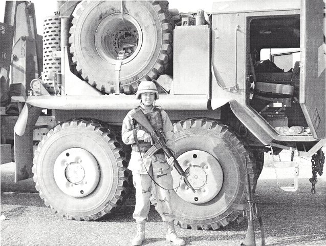 x My Daughter in-law in Iraq next to her Convoy Truck
